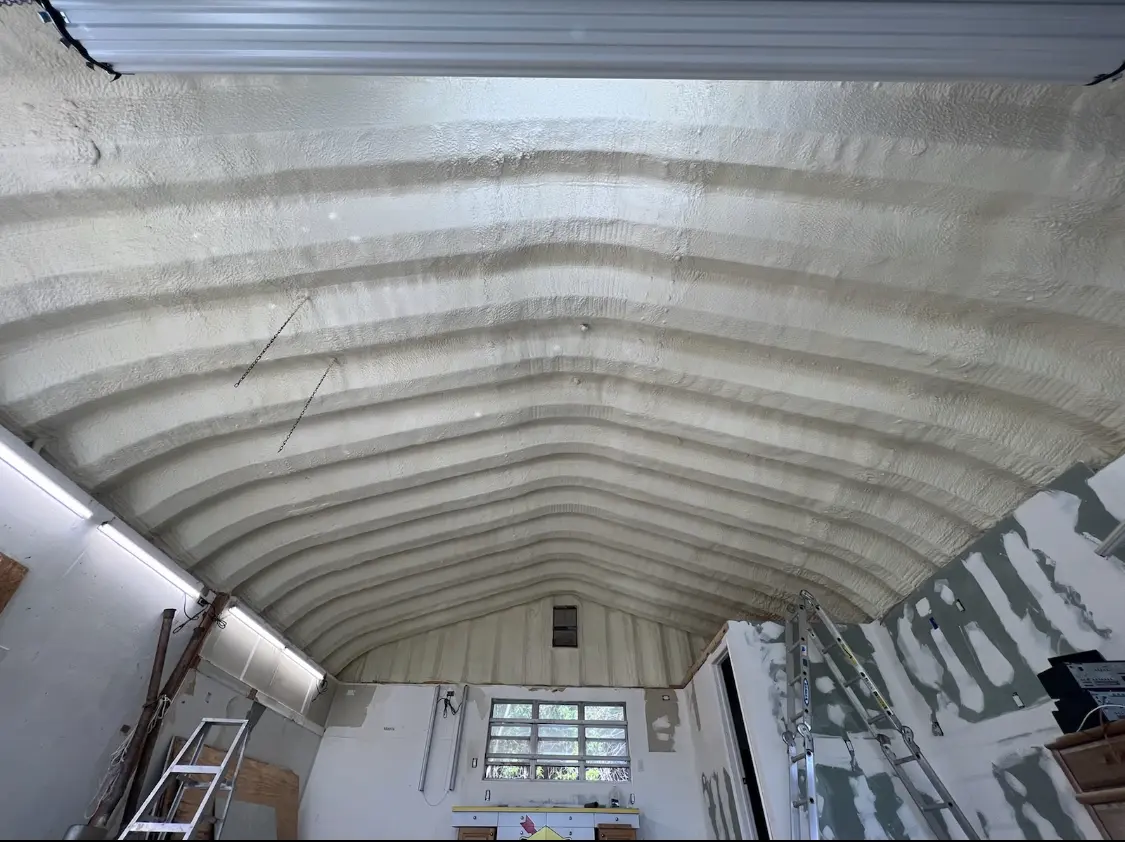 Spray polyurethane foam applied to the underside of a metal roof deck in Lenoir City